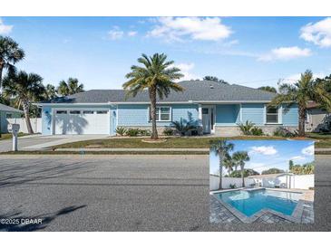 Newly renovated light blue home with a two-car garage, palm trees, and a spacious yard at 149 Sunrise Cove Cir, Ormond Beach, FL 32176