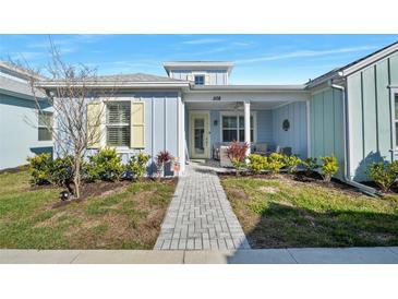 Charming coastal-style home with a welcoming front porch and landscaped yard at 508 High Tide Ln, Daytona Beach, FL 32124