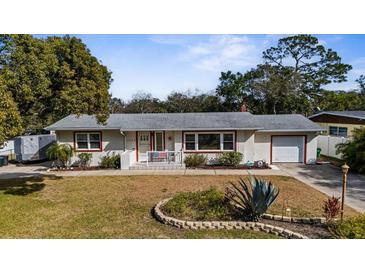 Charming single-story home with well-maintained front yard and an attached one-car garage at 1705 Cordova Ave, Daytona Beach, FL 32117