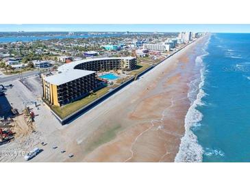Aerial view of oceanfront hotel property with direct beach access and pool at 2301 S Atlantic Ave # 230, Daytona Beach, FL 32118