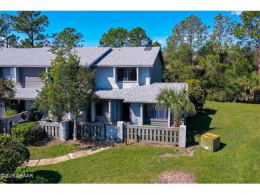 Charming two-story home with well-maintained landscaping, offering a welcoming curb appeal at 150 Limewood Pl # F, Ormond Beach, FL 32174