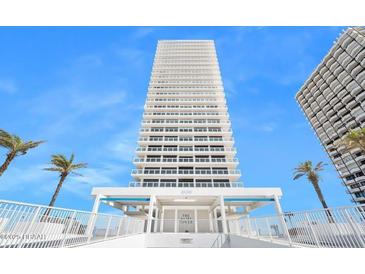 Stunning view of the Aliki Tower condominium building on a clear, sunny day at 3000 N Atlantic Ave # 11, Daytona Beach, FL 32118