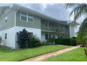 Well-maintained two-story condo building with lush landscaping and charming curb appeal in a desirable location at 840 Center Ave # 920, Holly Hill, FL 32117