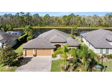 A well-maintained home features a three-car garage and professional landscaping at 1316 Harwick Ln, Ormond Beach, FL 32174
