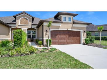 Charming one-story home with a well-manicured lawn and a two-car garage at 3205 Bailey Ann Dr, Ormond Beach, FL 32174