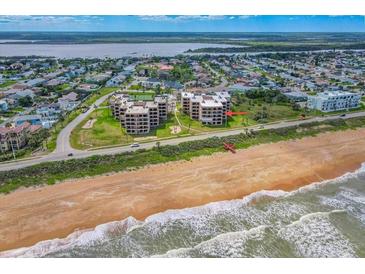 Breathtaking aerial view of a beachfront condo with ocean views and direct beach access at 3370 Ocean Shore Blvd # 206B, Ormond Beach, FL 32176