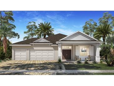 Charming single-story home with a three-car garage, manicured lawn, and inviting front porch at 1720 Lake Reserve Dr, Deland, FL 32724