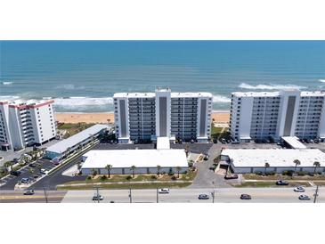 Expansive aerial view of beachfront condos offering stunning ocean views and convenient beach access at 1155 Ocean Shore Blvd # 702, Ormond Beach, FL 32176