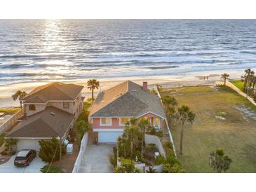Stunning oceanfront home with a meticulously maintained lawn and direct beach access at 1504 N Atlantic Ave, Daytona Beach, FL 32118
