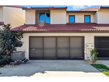 Beautful garage with tile roof and a secure entrance to home for peace of mind at 2934 Oceans Trce, Daytona Beach Shores, FL 32118