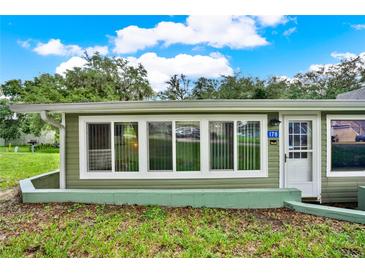 Ranch style home with green siding and multiple windows at 10301 Us Highway 27 # 178, Clermont, FL 34711