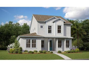Charming two-story home featuring white siding, a well-manicured lawn, and lush landscaping at 10552 Pearson Ave, Orlando, FL 32827