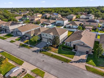 Charming neighborhood street view showcasing well-maintained homes and manicured lawns at 1961 Nations Way, Saint Cloud, FL 34769