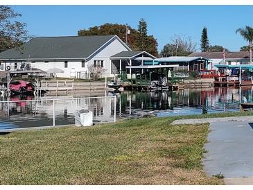 Waterfront home with private dock and boat slips at 1432 South Shore Dr, Tavares, FL 32778