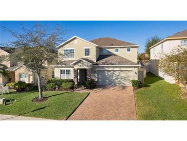 Two-story house with landscaping and brick driveway at 1741 Bonser Rd, Minneola, FL 34715