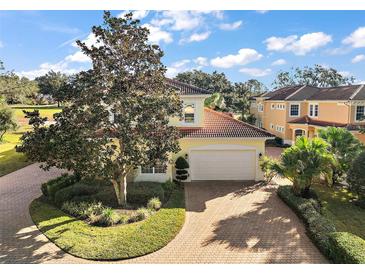 Beautiful two-story home with tile roof and large driveway at 26148 Avenida Las Colinas # 3B, Howey In The Hills, FL 34737