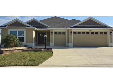 Attractive single-story home with two-car garage and landscaped lawn at 6851 Wendy Way, The Villages, FL 32163