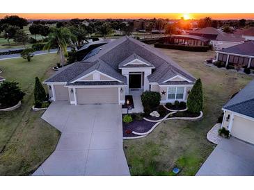 Attractive single-Gathering home with three-car garage, landscaped yard, and curb appeal at 3590 Ithaca Ter, The Villages, FL 32163