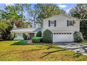 Beautiful ranch home with a spacious yard and two-car garage at 7470 Lake Marsha Dr, Orlando, FL 32819