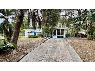 Cute bungalow with a screened porch and a spacious driveway at 819 Edgewater Dr, Eustis, FL 32726