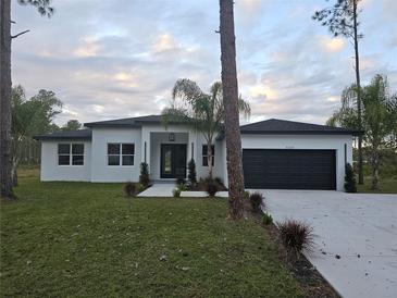 Two-story home with modern exterior and landscaping at 42025 Royal Trails Rd, Eustis, FL 32736