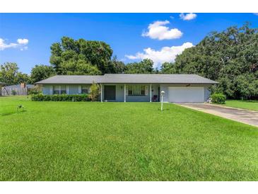 Ranch style home with a large yard at 2010 Hollywood Dr, Leesburg, FL 34748