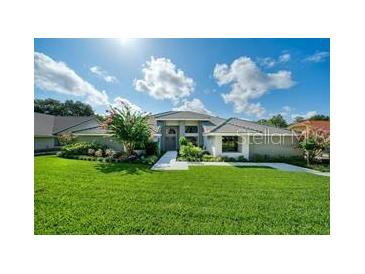 Beautiful two-story home with landscaped lawn and walkway at 365 N Spaulding Cv, Lake Mary, FL 32746