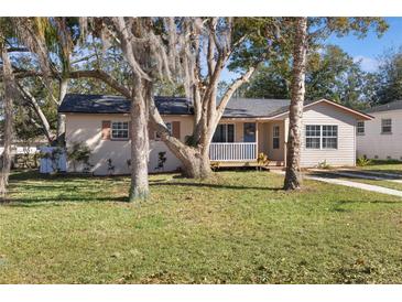 Charming single story home with mature landscaping and a large front yard at 1333 Lakeview Dr, Clermont, FL 34711