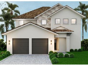 Two-story house with two-car garage, stone accents, and landscaped yard at 16046 Vetta Dr, Bella Collina, FL 34756