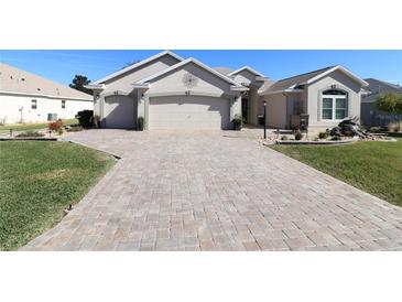 Beautiful home with three-car garage and paver driveway at 9059 Se 177Th Grassmere St, The Villages, FL 32162