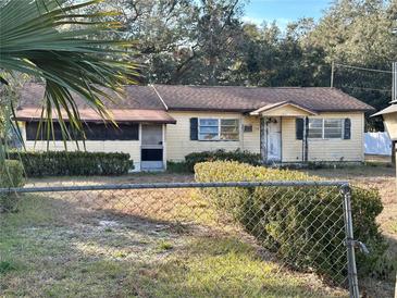 Ranch-style house with a fenced yard at 1109 Pioneer Trl, Leesburg, FL 34748