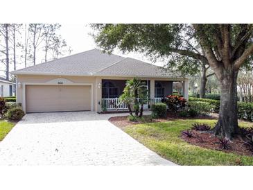 Single-story home with attached garage and landscaped yard at 2289 Twickingham Ct, Clermont, FL 34711