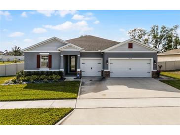 Two-story home with a two-car garage and well-maintained lawn at 17938 Hither Hills Cir, Winter Garden, FL 34787