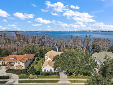 Luxury waterfront home with private dock and stunning lake views at 11644 Osprey Pointe Blvd, Clermont, FL 34711