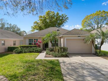 Charming single-story home showcasing well-maintained landscaping and a welcoming entrance at 3812 Westerham Dr, Clermont, FL 34711