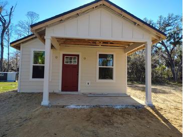 Charming new home construction featuring a cozy front porch and modern design elements at Lot 15 Indian Estates Cr 423, Lake Panasoffkee, FL 33538