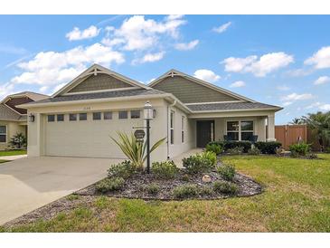 Beautiful single-Gathering home with landscaped yard and a two-car garage at 2184 Locklin Ln, The Villages, FL 32163