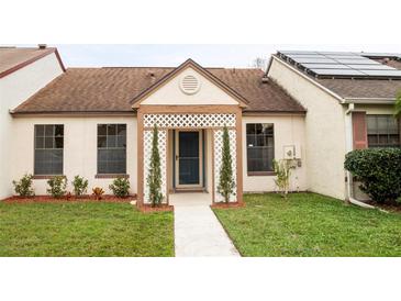 Charming single-story home with well-maintained front yard and decorative lattice entryway at 123 Dresdan Ct, Sanford, FL 32771