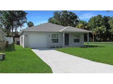 Charming single Gathering home with a one car garage, complemented by a well-maintained lawn at 2030 N Highland St, Mount Dora, FL 32757