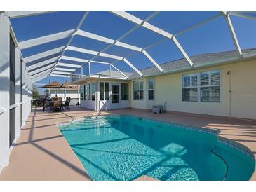 A refreshing screened-in pool, perfect for outdoor relaxation and entertaining near the home at 17490 Se 110Th Ter, Summerfield, FL 34491
