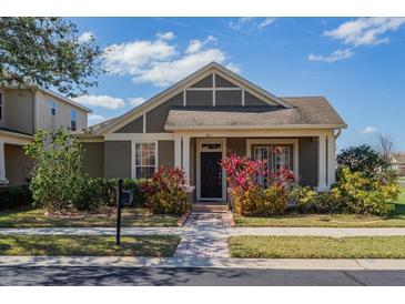 Charming one-story home with brick walkway and beautifully landscaped front yard in a residential neighborhood at 303 White Water Bay Dr, Groveland, FL 34736