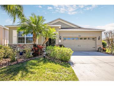 Charming single-Gathering home with a two-car garage, lovely landscaping, and attractive stone accents at 5262 Royce Dr, Mount Dora, FL 32757