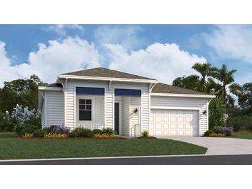 Charming single-story home featuring a two-car garage and welcoming front porch in a well-maintained community at 999 Fiesta Key Cir, Lady Lake, FL 32159