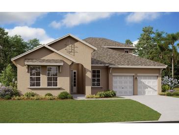 Attractive, tan-colored single-story home with a well-manicured lawn, lush landscaping, and attached two-car garage at 14347 Crest Palm Ave, Windermere, FL 34786