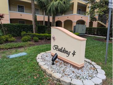 Close up view of the sign for Building 4 in this well-maintained condominium community at 8801 Worldquest Blvd # 4203, Orlando, FL 32821