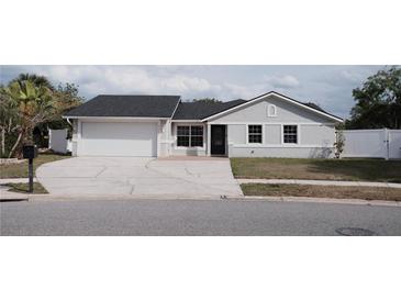 Well-kept single-story home with attached garage and inviting front yard, great curb appeal at 2600 Pisces Dr, Orlando, FL 32837