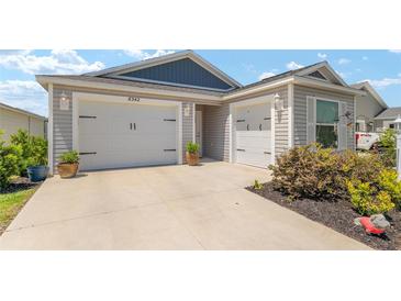 Charming home featuring a three-car garage, well-kept landscaping, and excellent curb appeal at 6342 Whittle Ct, The Villages, FL 32163