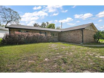Well-kept single story home with a brick exterior and lush green front lawn with established shrubbery at 30641 County Road 435, Sorrento, FL 32776