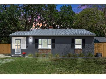 Charming single-story home featuring a new metal roof and freshly painted exterior at 602 Ross St, Leesburg, FL 34748