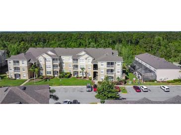 An aerial view of a well-maintained multi-Gathering property in a lush, green surrounding at 2310 Silver Palm Dr # 301, Kissimmee, FL 34747